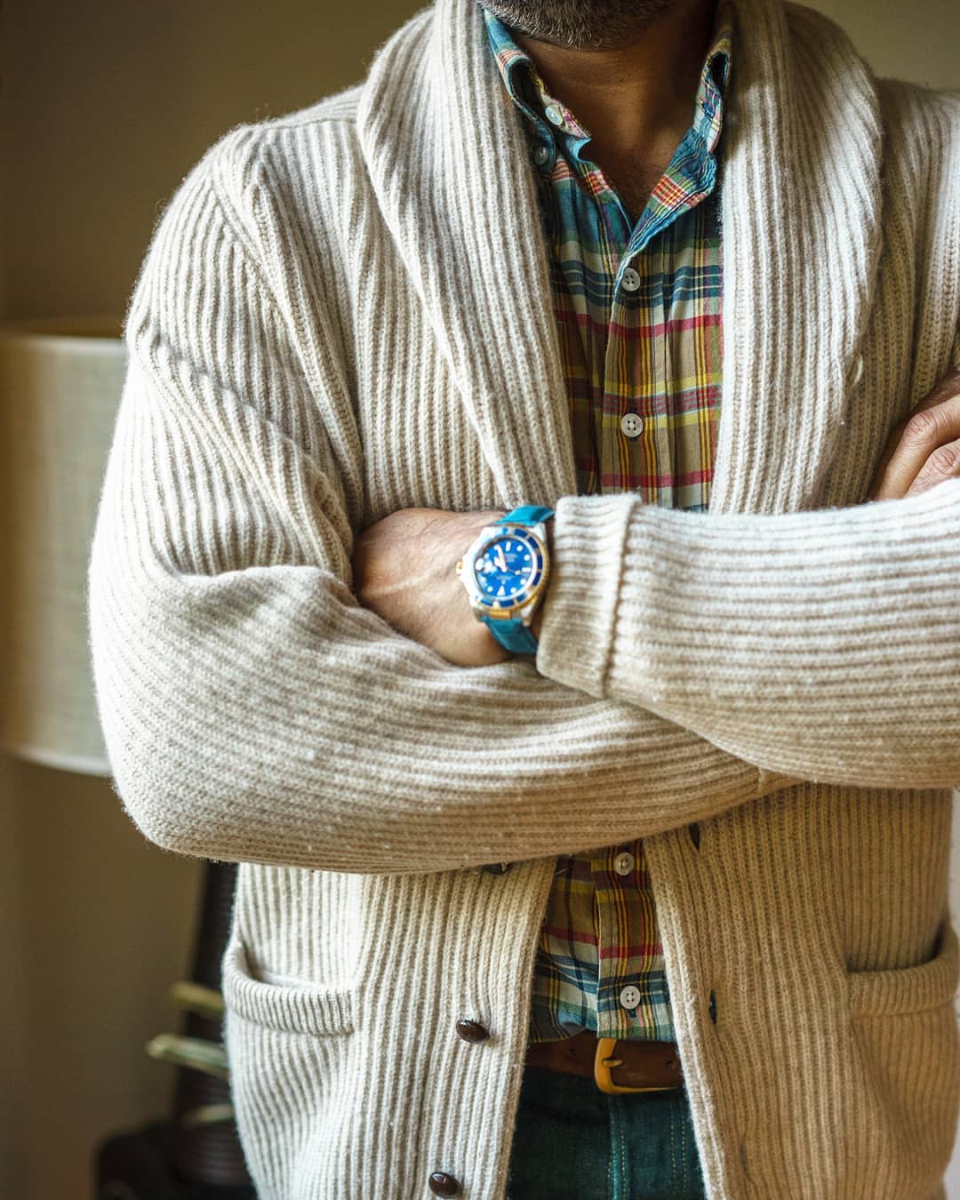 Light colors, cream cardigan, teal watch... balance. Gotta love it.